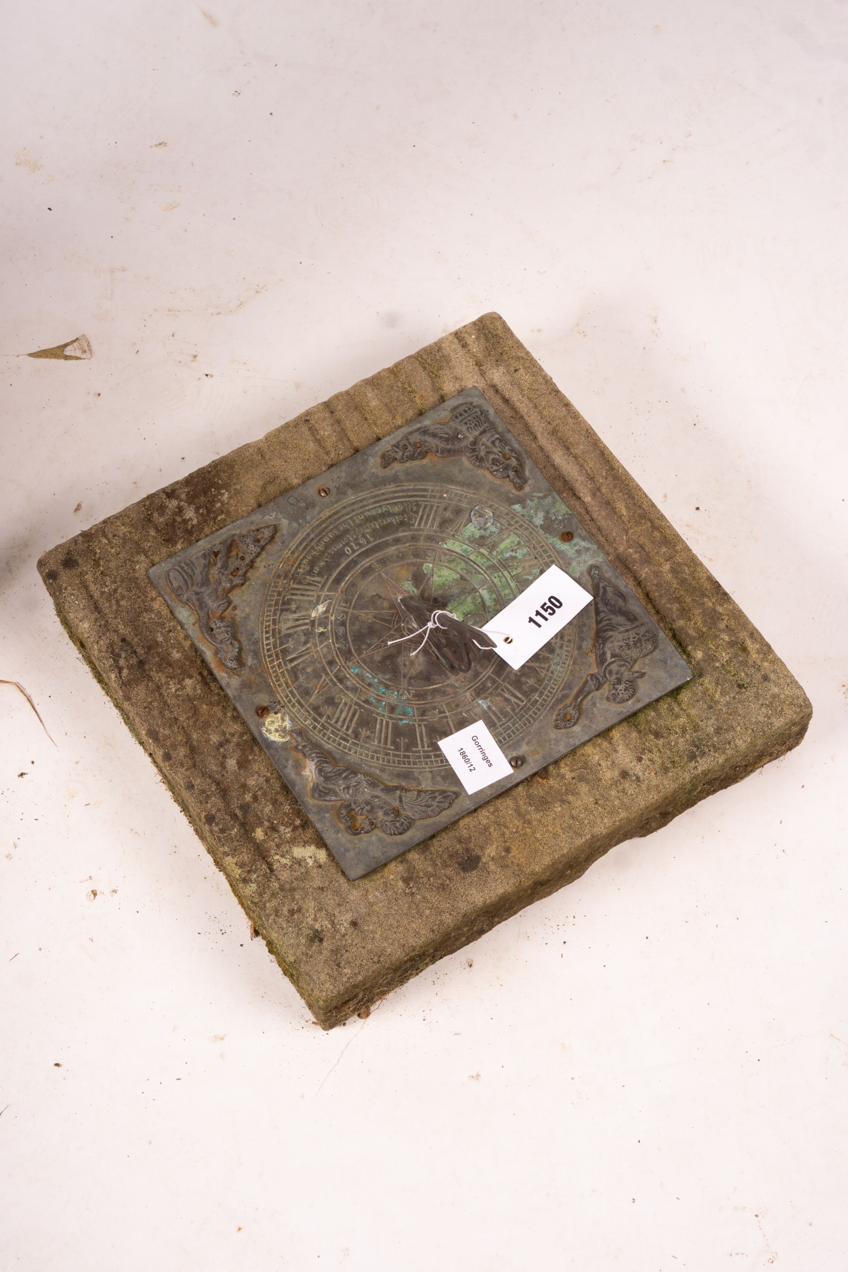 A 17th century style sun dial on Portland stone plinth, height 70cm